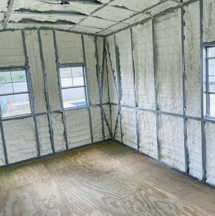 Closed-cell spray foam insulation applied to wall cavities in a residential project in Leland